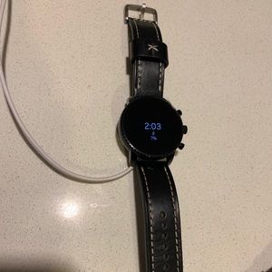 Fossil Gen 4 smart watch with charger.